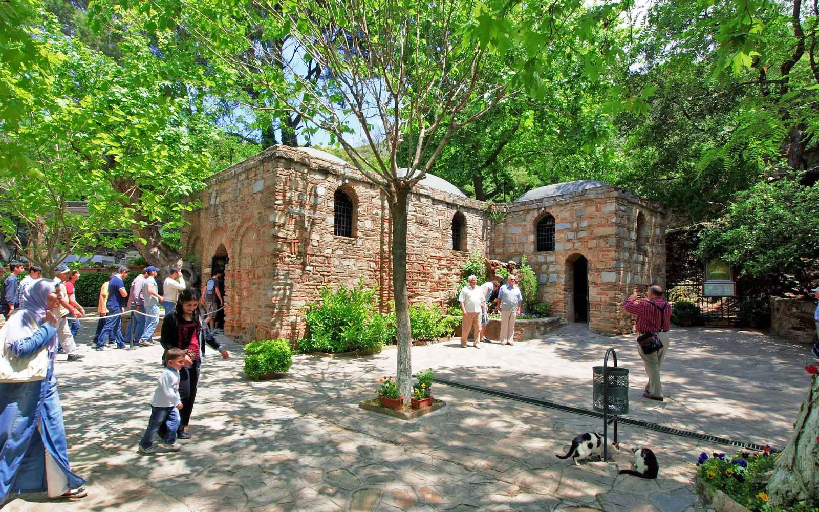 The stone chapel of the House of the Virgin Mary set among trees on Bülbül Mountain near Ephesus, Türkiye