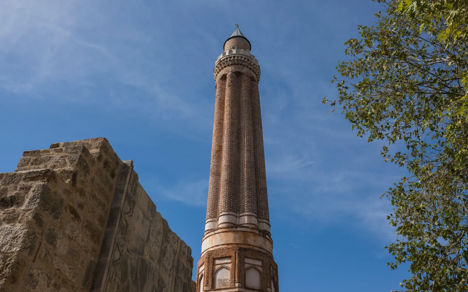 The fluted minaret of Yivli Minare Mosque rising above the old stone streets of Kaleiçi, Antalya